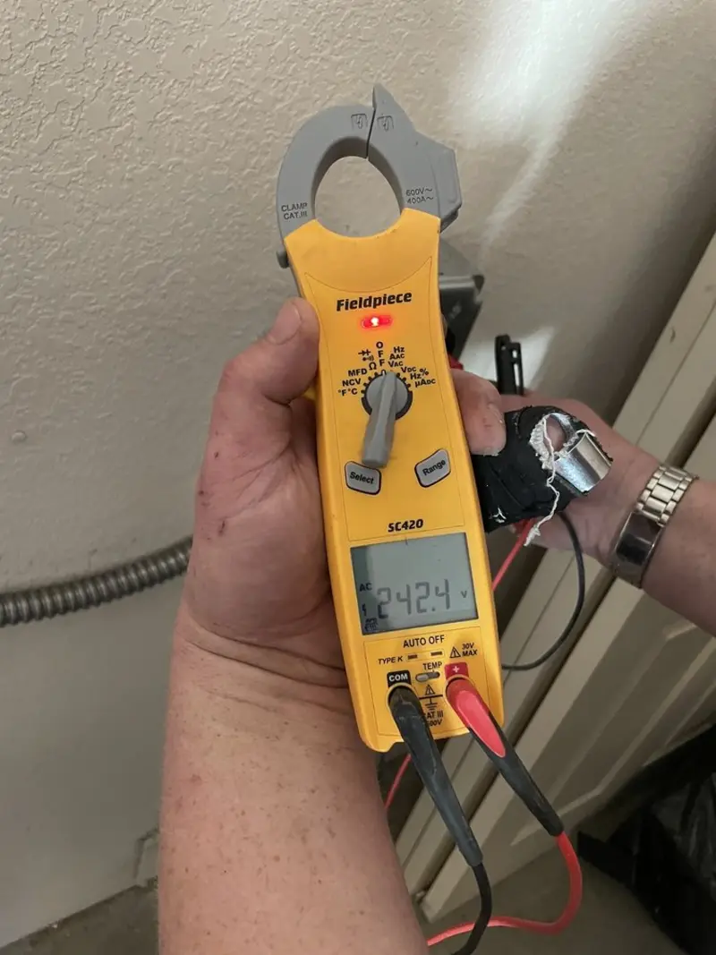 Voltage testing with clamp meter during Electrical Installation Services in Meridianville